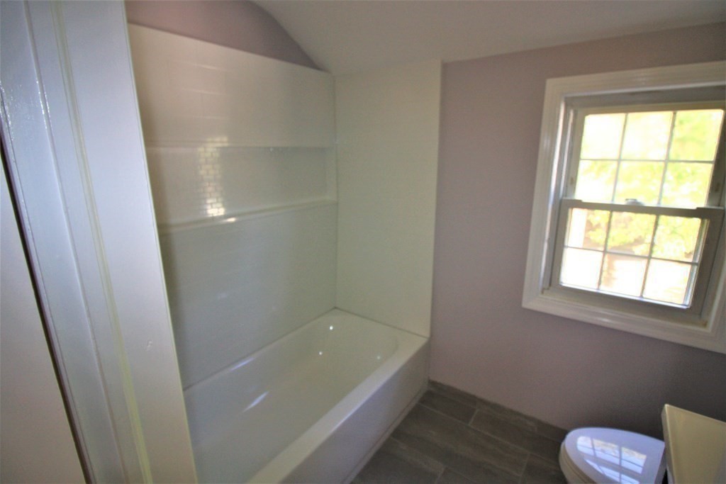 116 Donbray Road Springfield, MA 01119 - Photo 15 of 42 a bathroom with a tub and window