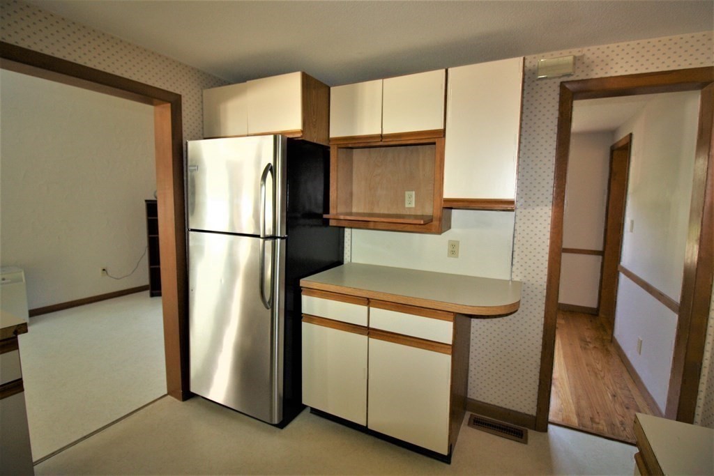 116 Donbray Road Springfield, MA 01119 - Photo 25 of 42 a kitchen with refrigerator a microwave and sink