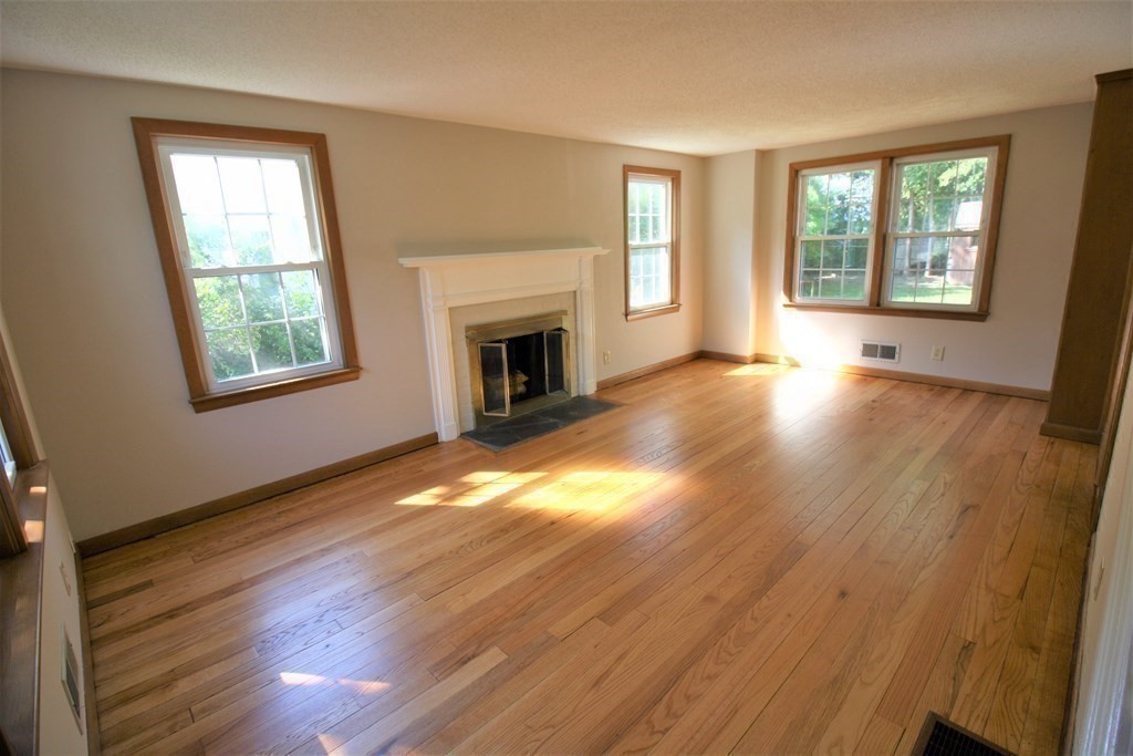 116 Donbray Road Springfield, MA 01119 - Photo 3 of 42 a view of an empty room with wooden floor and a window