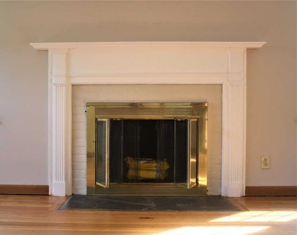 116 Donbray Road Springfield, MA 01119 - Photo 5 of 42 a view of a livingroom with wooden floor and a fireplace
