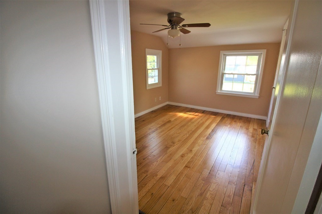 116 Donbray Road Springfield, MA 01119 - Photo 9 of 42 a view of empty room with wooden floor and fan