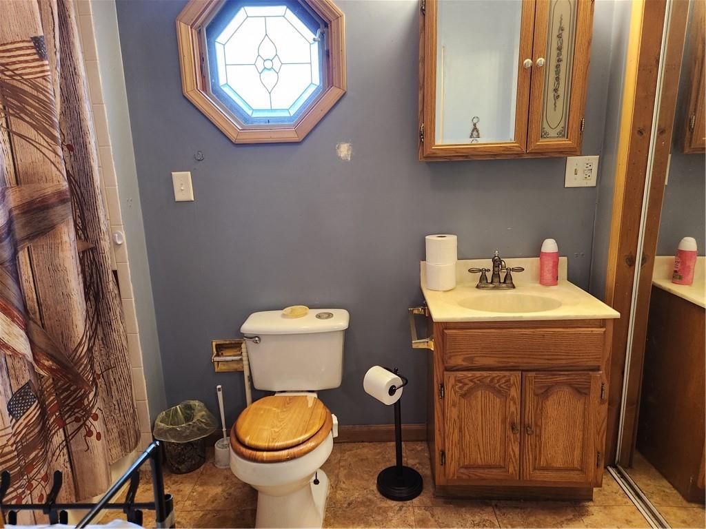 221 Meadowview Drive Latrobe, PA 15650 - Photo 11 of 15 a bathroom with a toilet and a sink