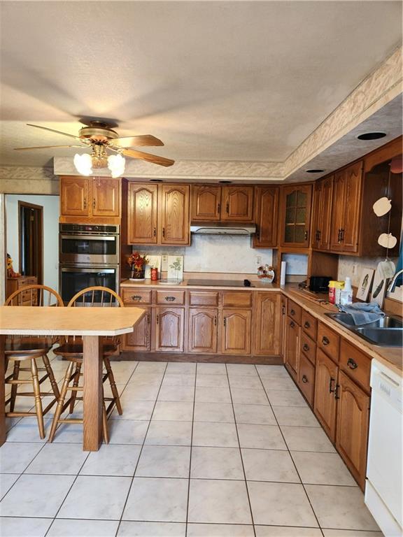 221 Meadowview Drive Latrobe, PA 15650 - Photo 6 of 15 a kitchen with stainless steel appliances granite countertop a sink and cabinets