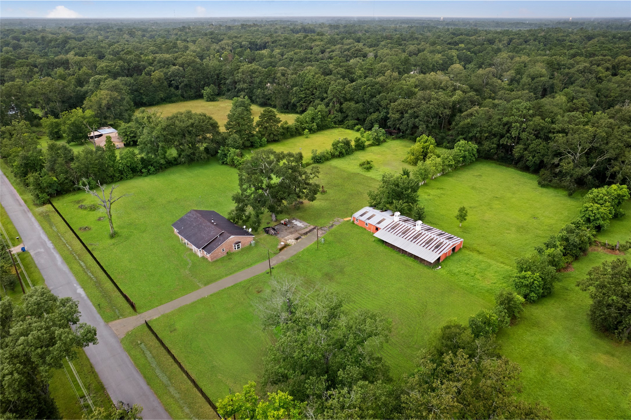 27093 Frye Road Splendora, TX 77372 - Photo 2 of 32 an aerial view of a golf course with a yard