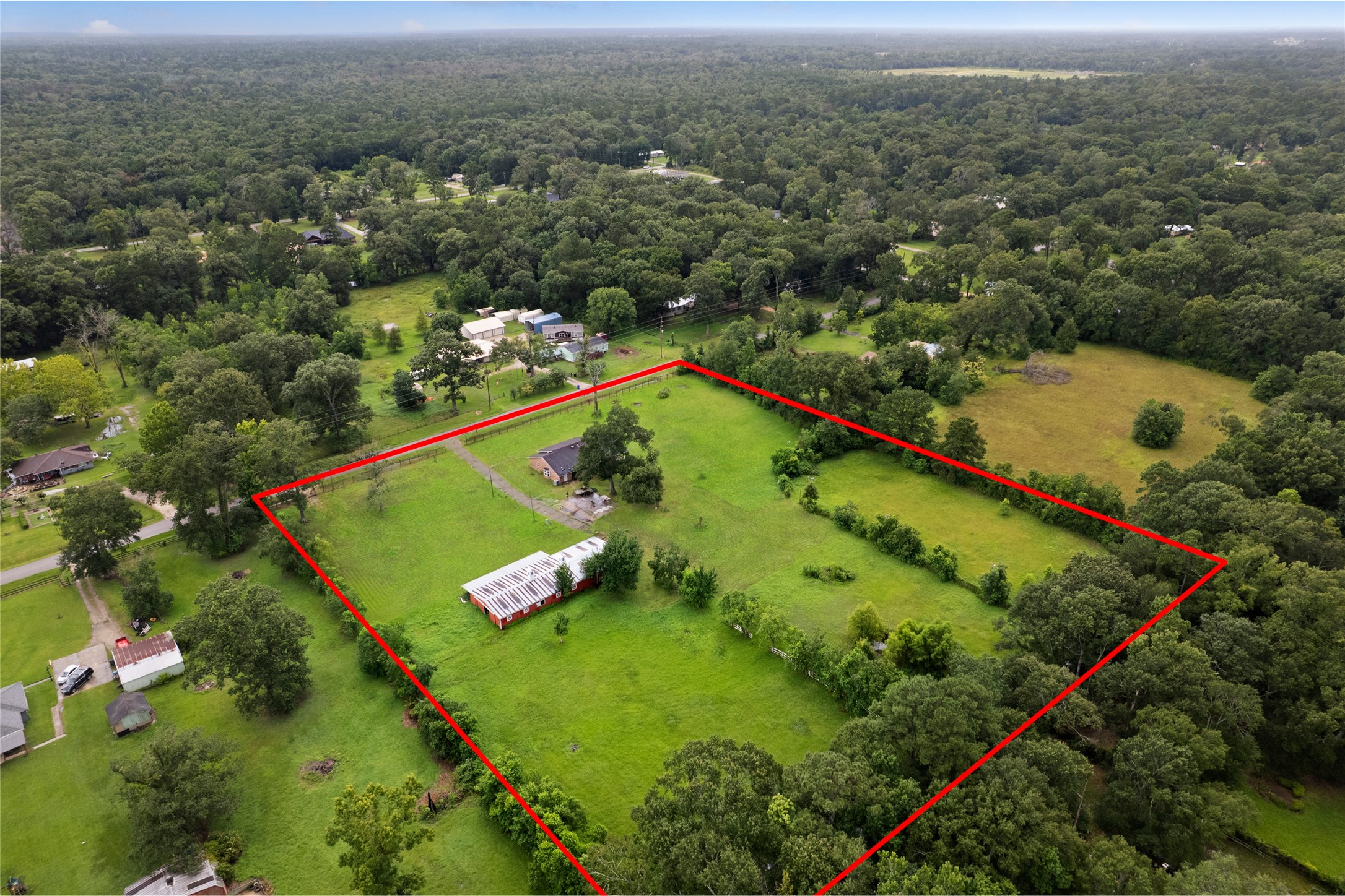 27093 Frye Road Splendora, TX 77372 - Photo 3 of 32 an aerial view of a pool and trees