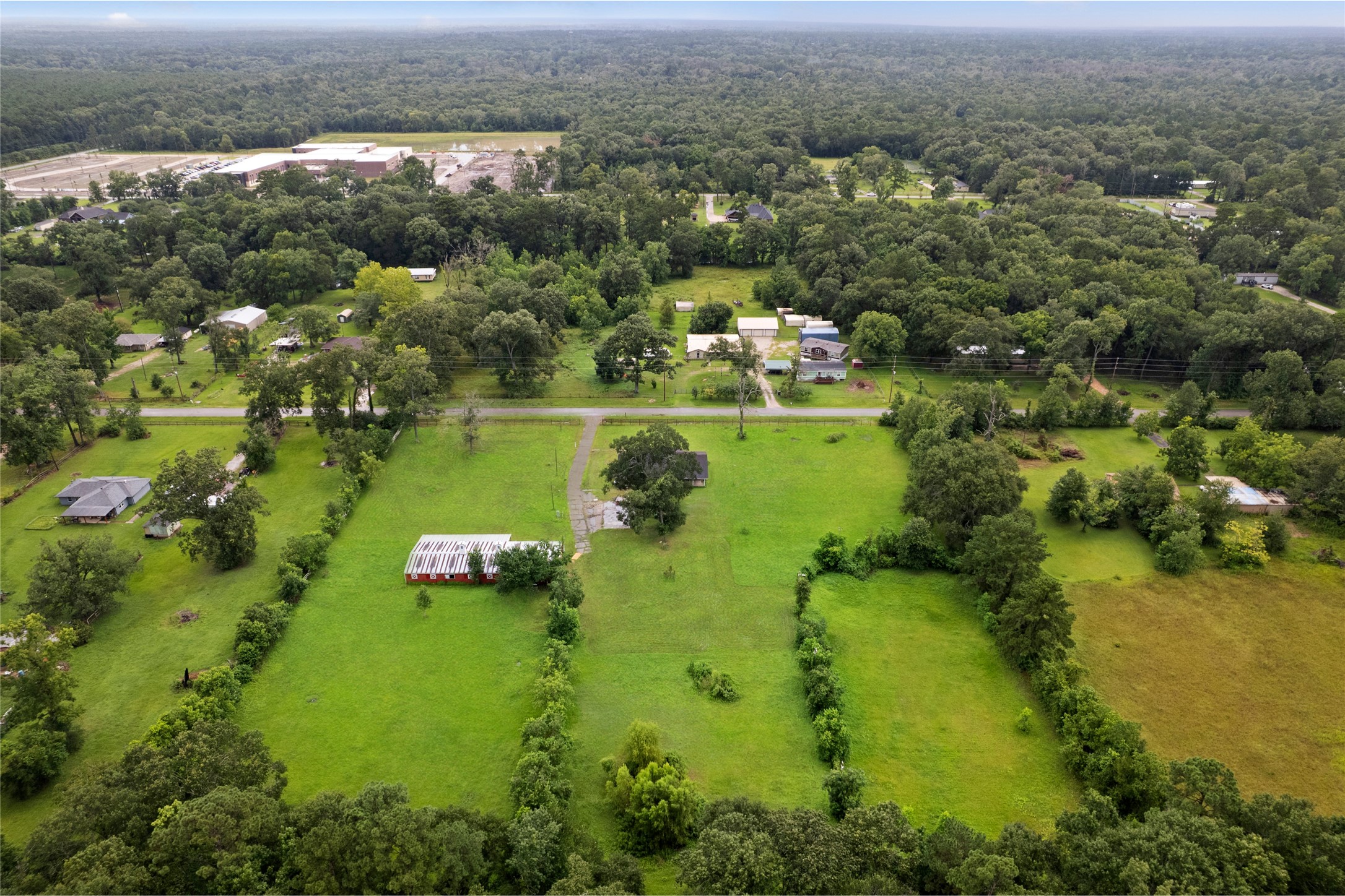 27093 Frye Road Splendora, TX 77372 - Photo 4 of 32 a view of a lake with a city