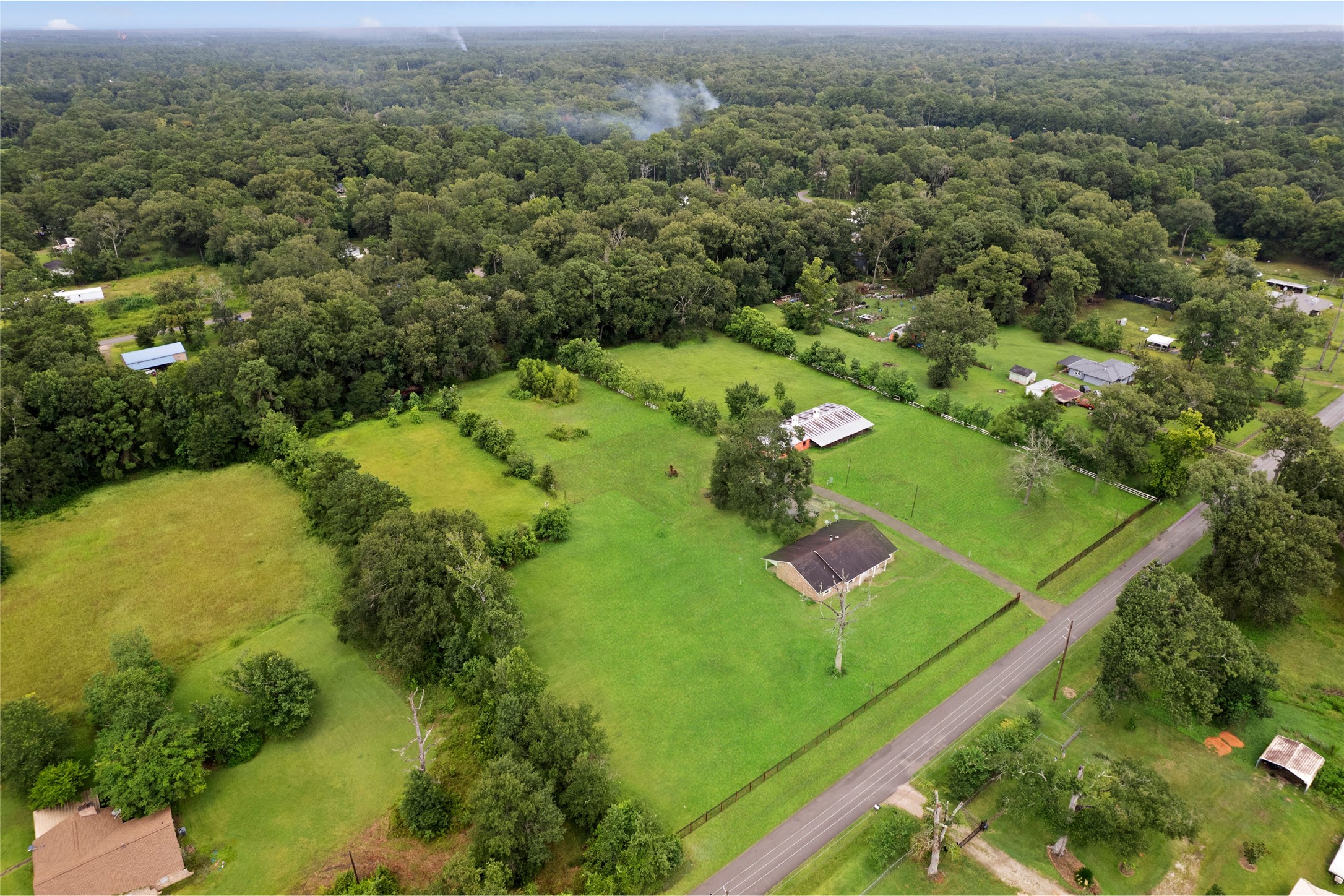 27093 Frye Road Splendora, TX 77372 - Photo 5 of 32 an aerial view of residential houses with outdoor space