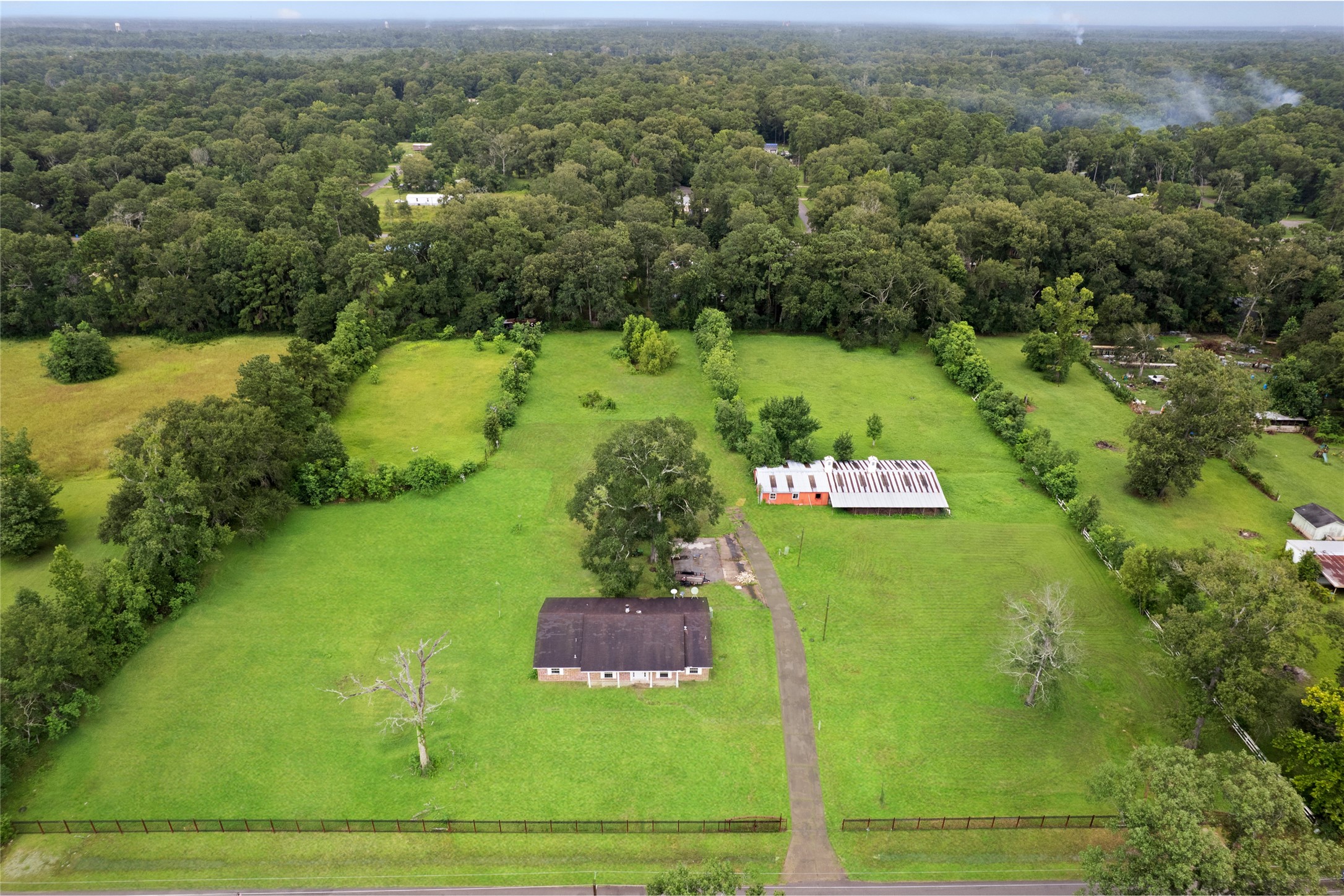 27093 Frye Road Splendora, TX 77372 - Photo 6 of 32 a view of a lake with houses