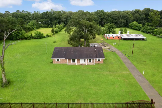 a view of a swimming pool with a yard