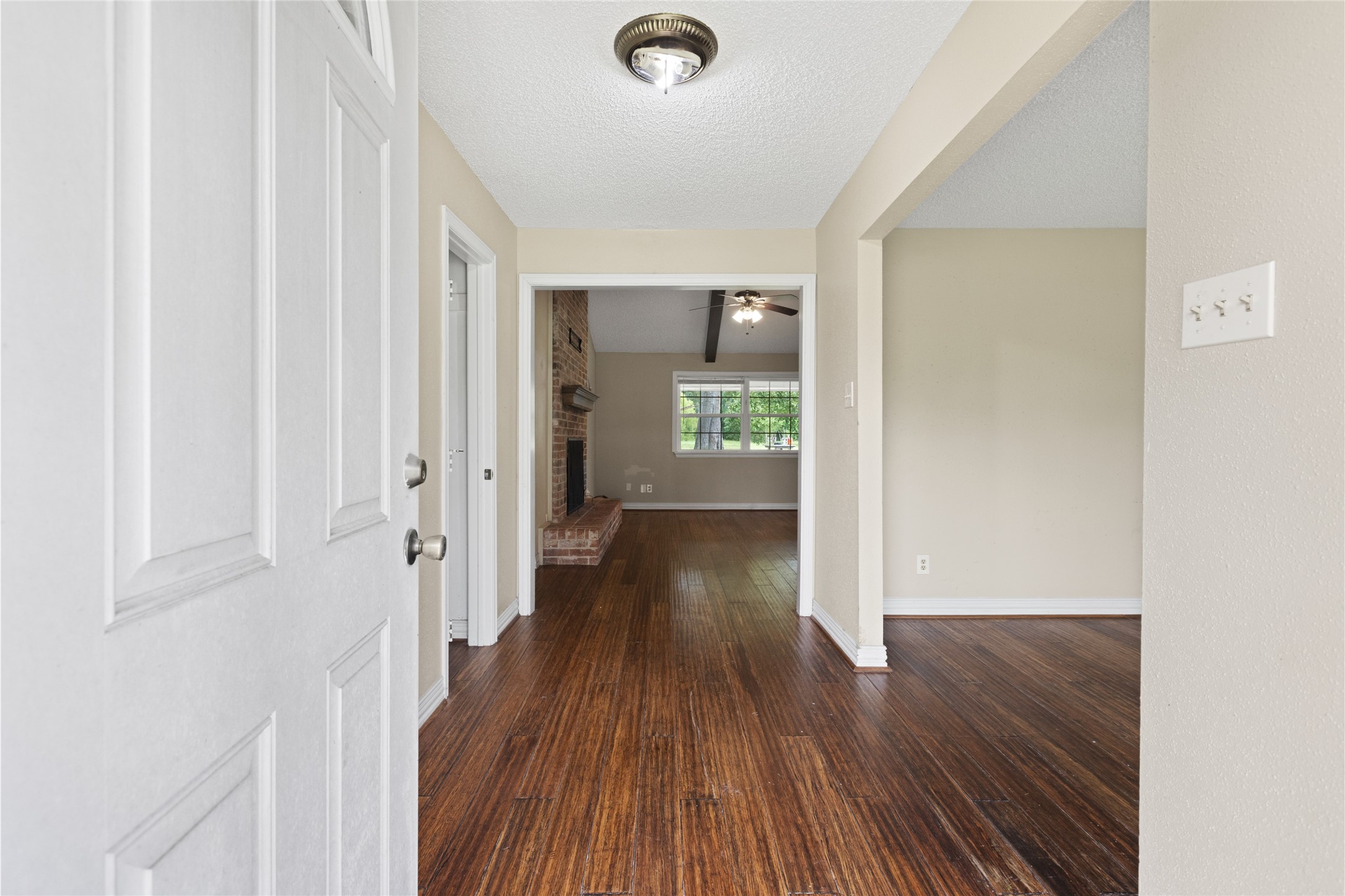 27093 Frye Road Splendora, TX 77372 - Photo 9 of 32 a view of a hallway with wooden floor