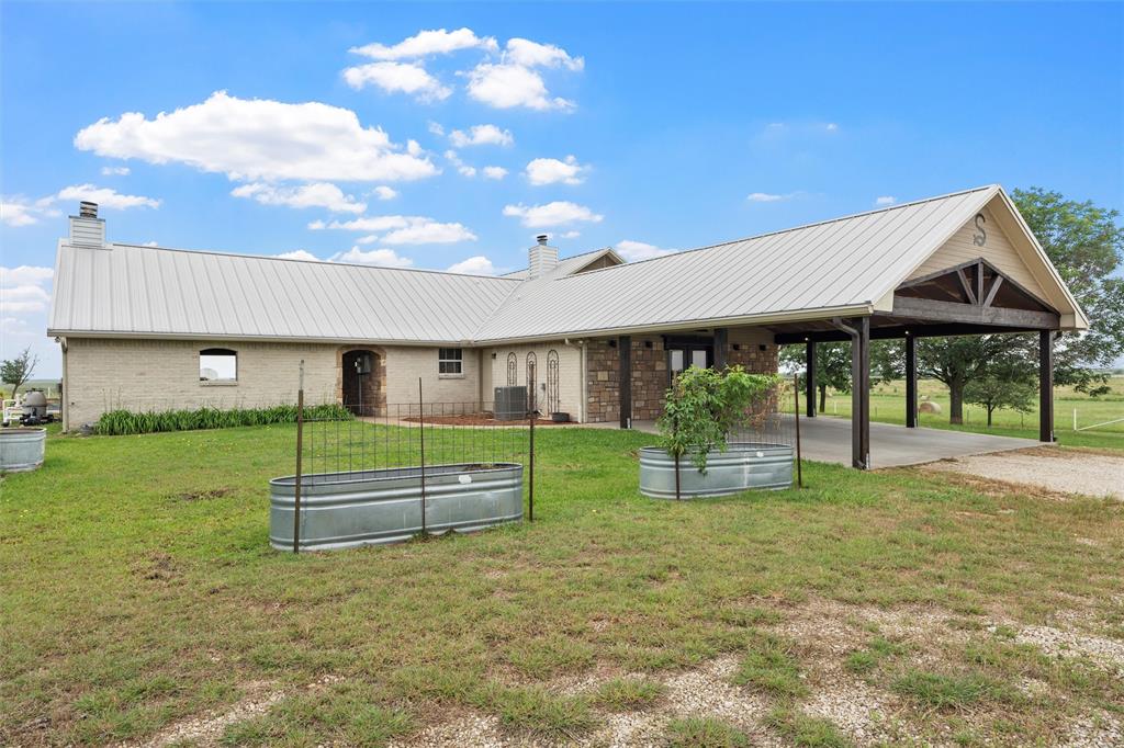 3057 Holy Road Abbott, TX 76621 - Photo 6 of 39 a view of an house with backyard porch and furniture