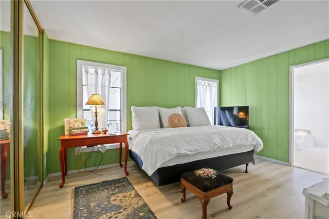 a bedroom with a bed and a table