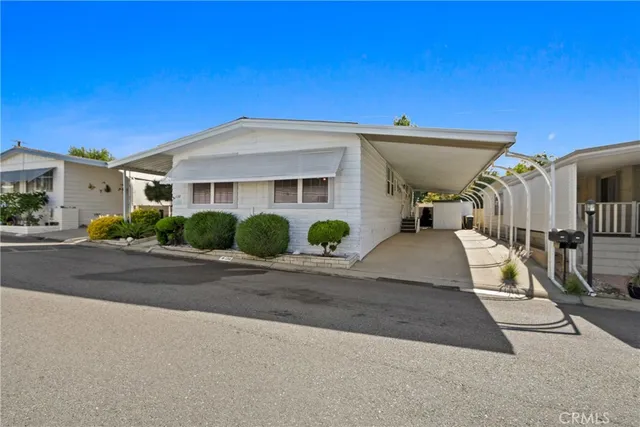 a view of a house with a street
