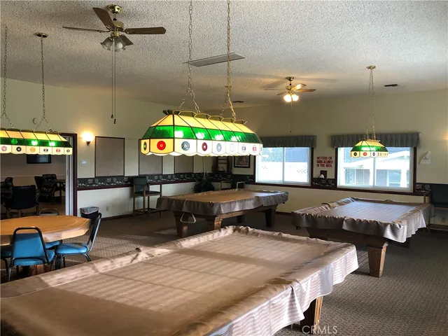 a kitchen with a table and chairs