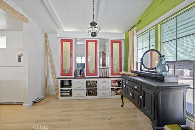 a view of a livingroom with furniture window and wooden floor
