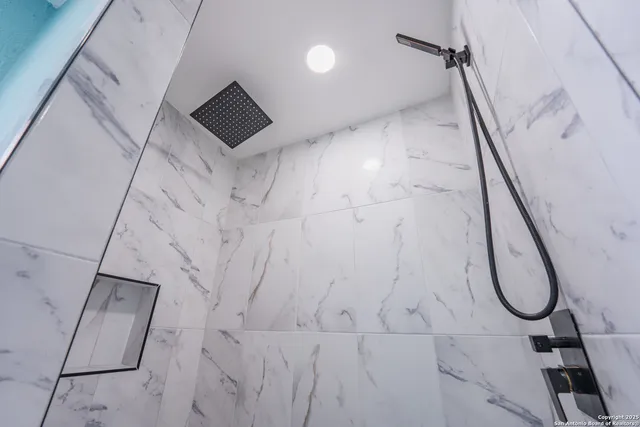 a view of a brick house with large windows