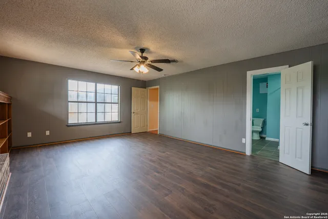 a bathroom with a shower sink and mirror
