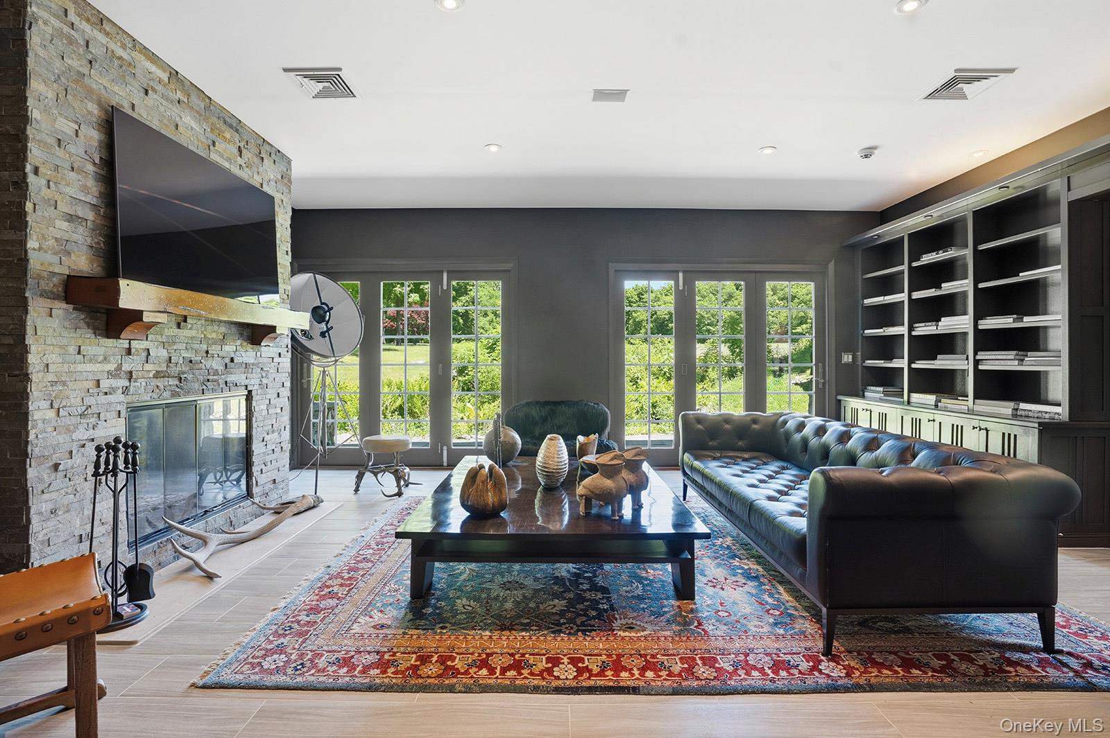 180 Dean Road Carmel, NY 10512 - Photo 11 of 50 Media room with patio access and built in shelving