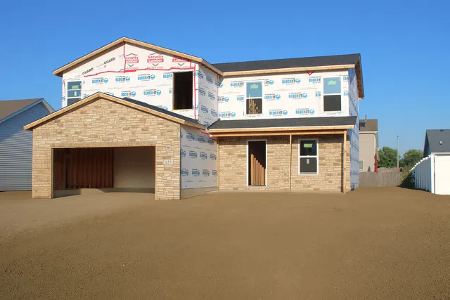 a view of a house with a garage