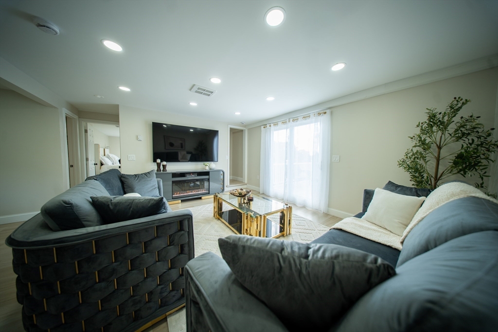 293 Brookfield Road Brimfield, MA 01010 - Photo 11 of 30 a living room with furniture and a flat screen tv