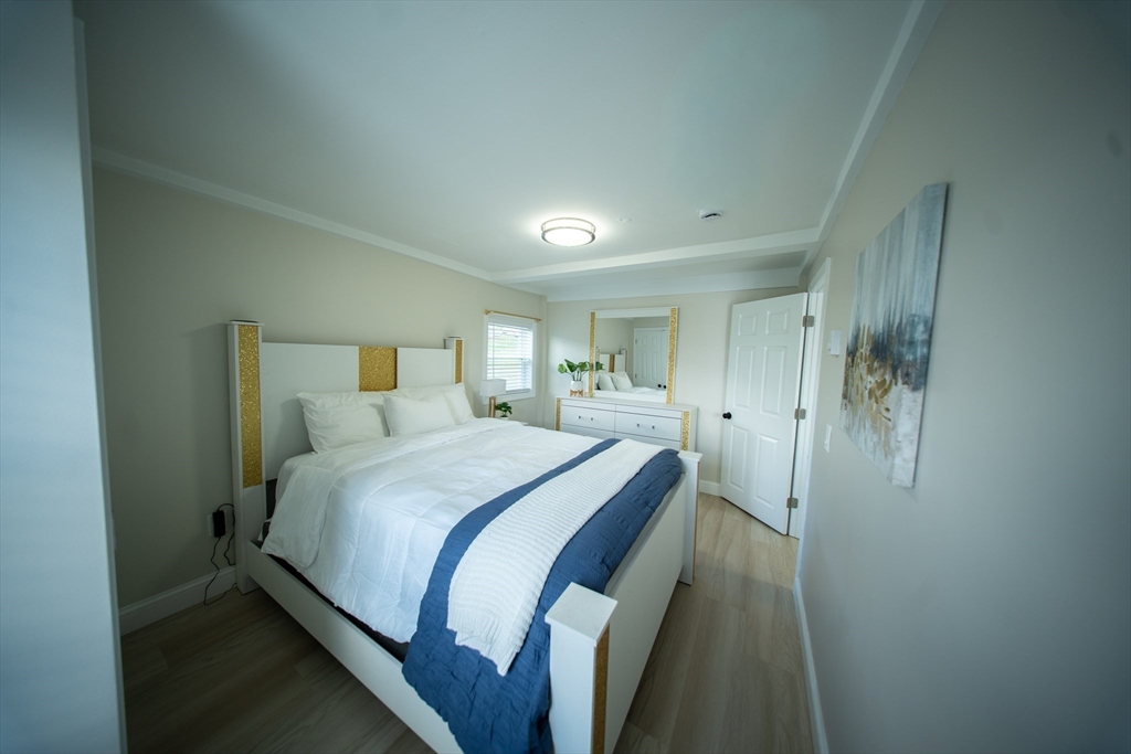 293 Brookfield Road Brimfield, MA 01010 - Photo 13 of 30 a bed room with a bed and a mirror