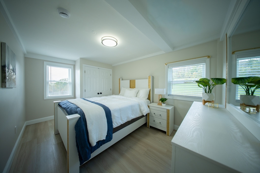 293 Brookfield Road Brimfield, MA 01010 - Photo 14 of 30 a spacious bedroom with two beds and a potted plant