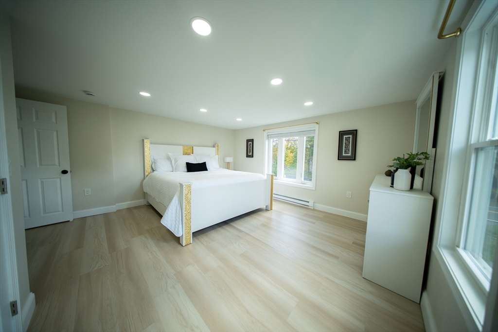 293 Brookfield Road Brimfield, MA 01010 - Photo 15 of 30 a bed room with furniture and wooden floor