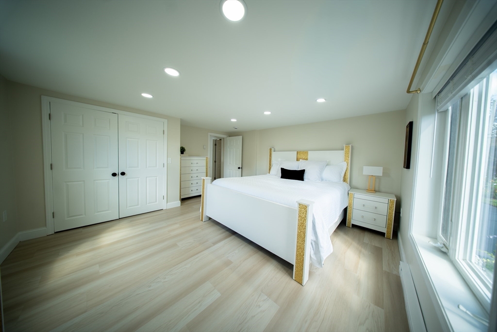 293 Brookfield Road Brimfield, MA 01010 - Photo 16 of 30 a room with a bed and a large window