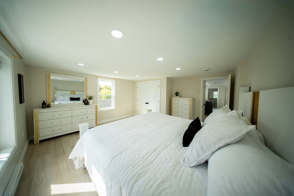 293 Brookfield Road Brimfield, MA 01010 - Photo 17 of 30 a bed room with furniture and a large mirror