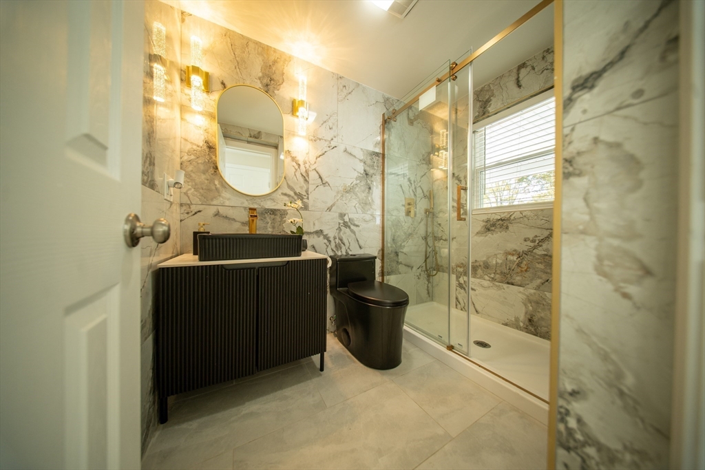 293 Brookfield Road Brimfield, MA 01010 - Photo 19 of 30 a bathroom with a sink and a mirror