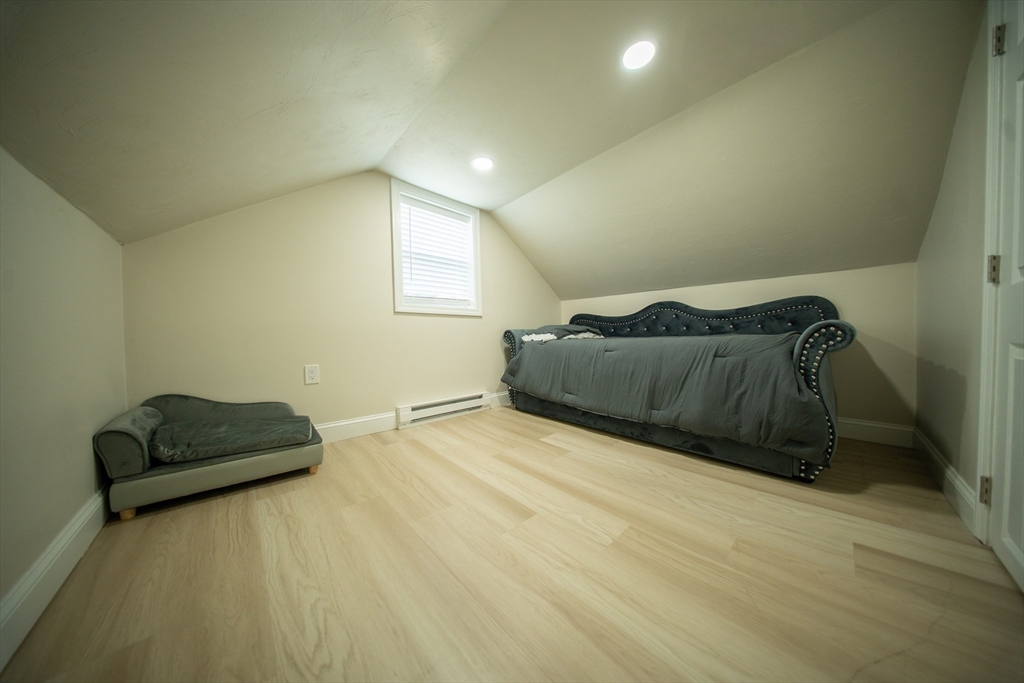 293 Brookfield Road Brimfield, MA 01010 - Photo 22 of 30 a bedroom with a bed and a couch