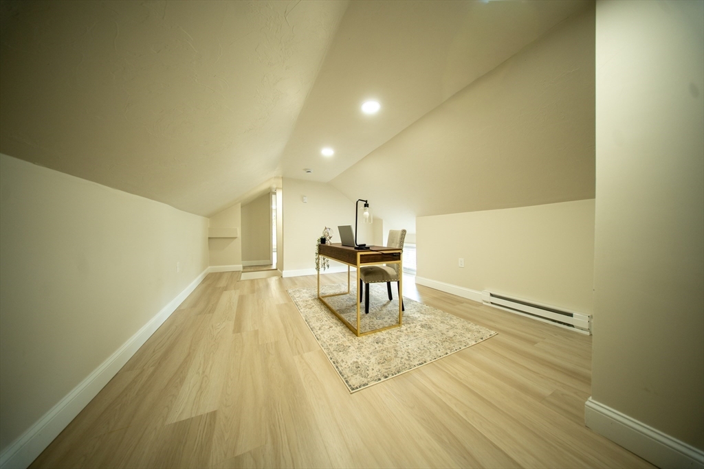 293 Brookfield Road Brimfield, MA 01010 - Photo 23 of 30 a view of a room with wooden floor a sink and a refrigerator