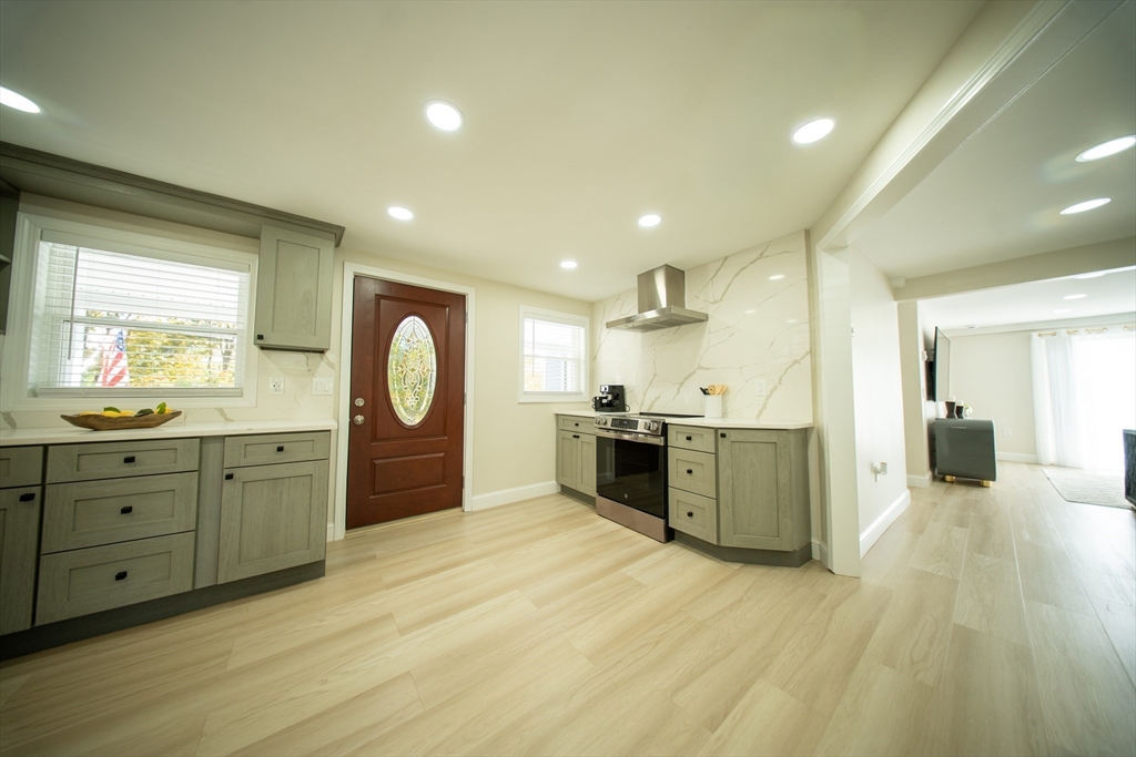 293 Brookfield Road Brimfield, MA 01010 - Photo 9 of 30 a large kitchen with stainless steel appliances granite countertop a stove a sink and a refrigerator