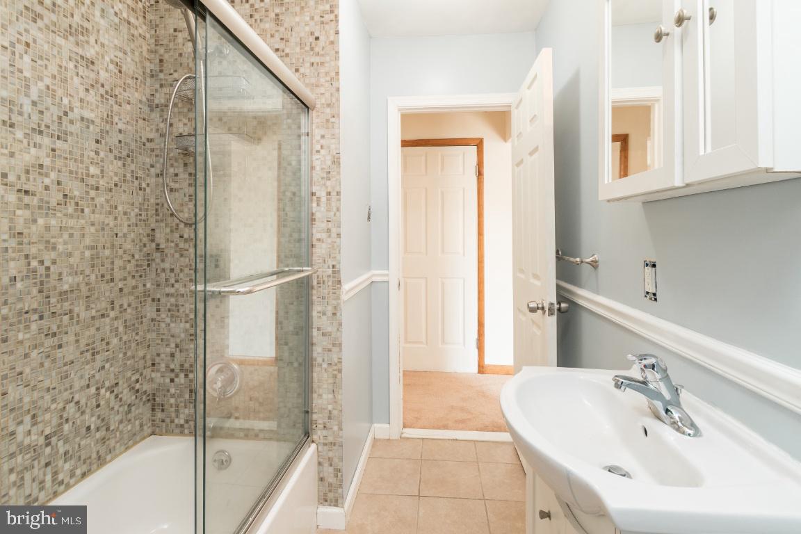 135 Cedar Hill Road Baltimore, MD 21225 - Photo 14 of 48 First floor full bathroom 1 freshly painted