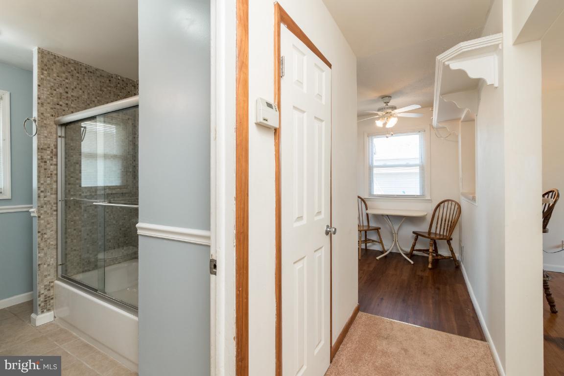 135 Cedar Hill Road Baltimore, MD 21225 - Photo 15 of 48 First floor hallway to kitchen from family room