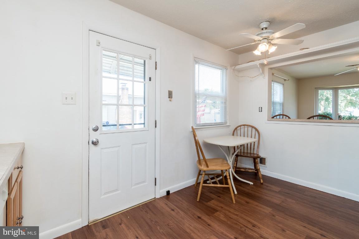 135 Cedar Hill Road Baltimore, MD 21225 - Photo 21 of 48 Eat in kitchen area w/serving hatch to dining room