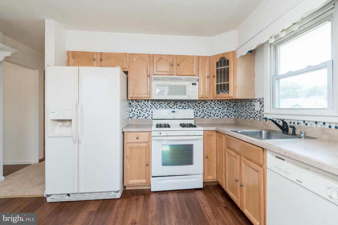 135 Cedar Hill Road Baltimore, MD 21225 - Photo 24 of 48 Fresh paint in kitchen and new flooring