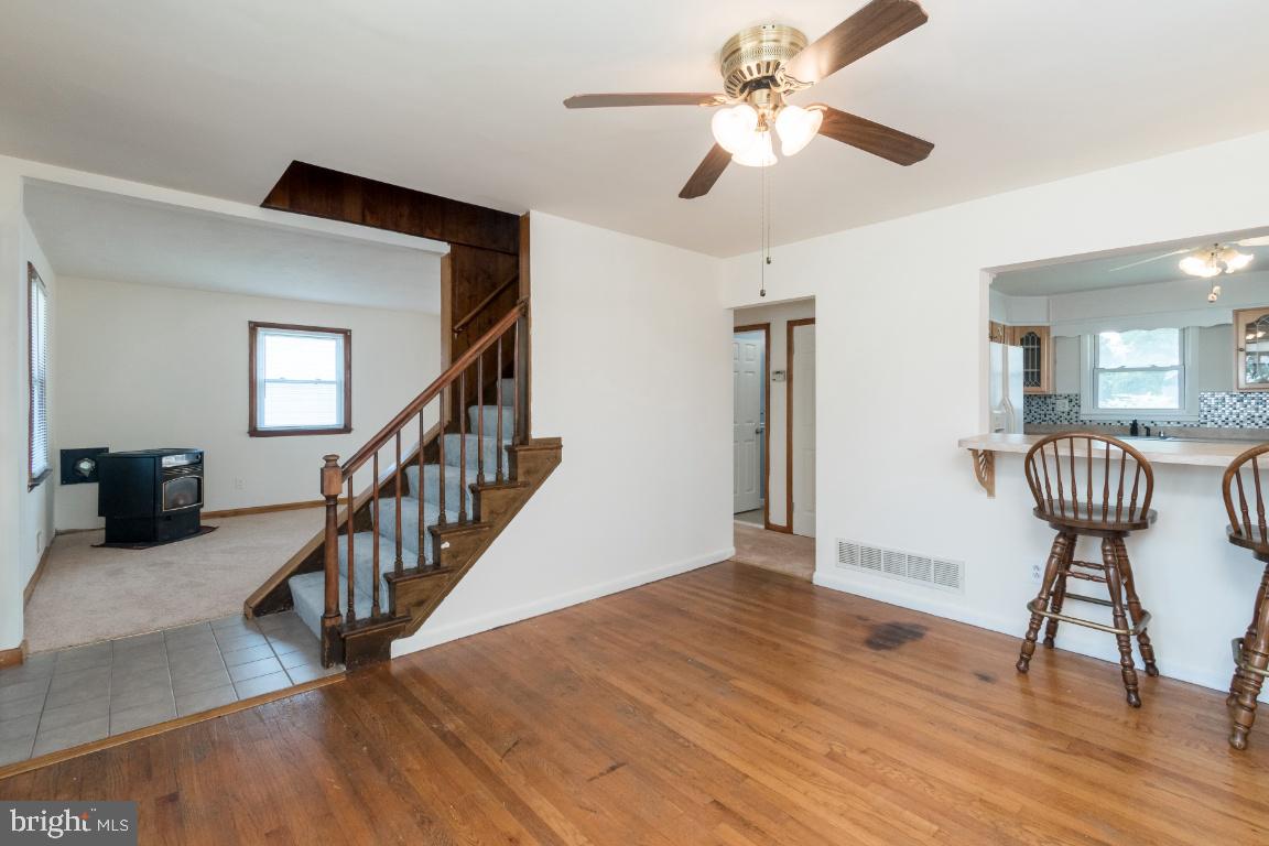 135 Cedar Hill Road Baltimore, MD 21225 - Photo 25 of 48 Large dining room area leads to kitchen