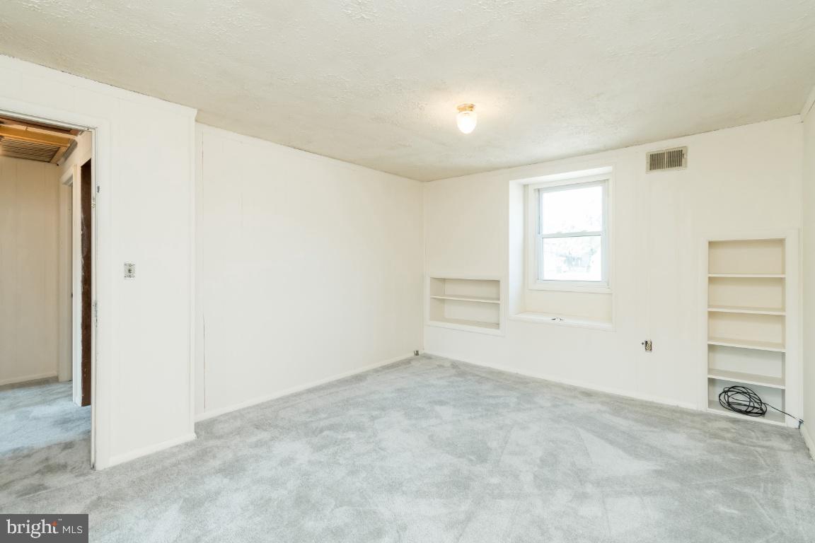 135 Cedar Hill Road Baltimore, MD 21225 - Photo 28 of 48 Master bedroom with nice built in shelves