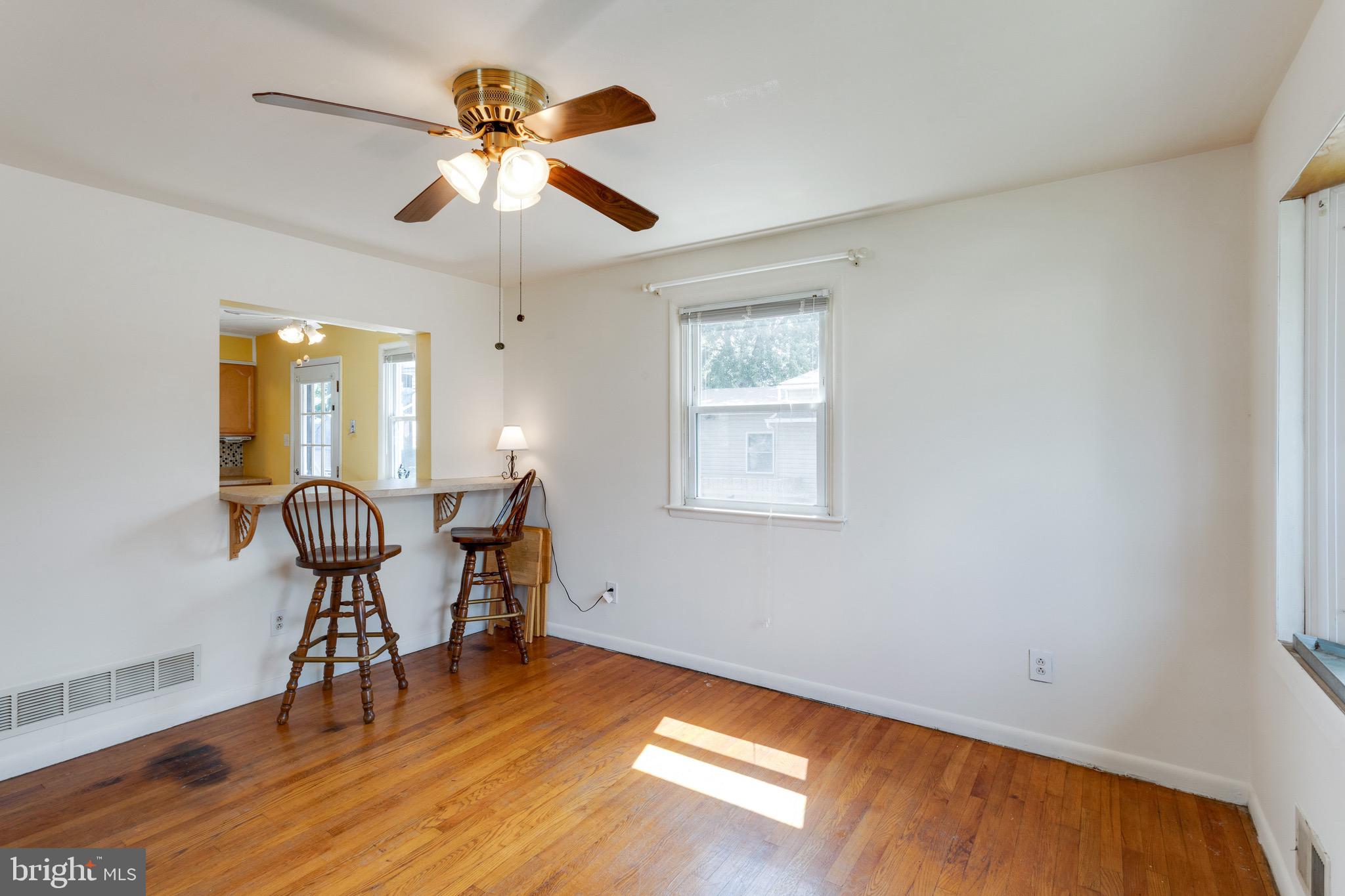 135 Cedar Hill Road Baltimore, MD 21225 - Photo 10 of 48 Dining Room w/ Hardwood Floors, ceiling fan