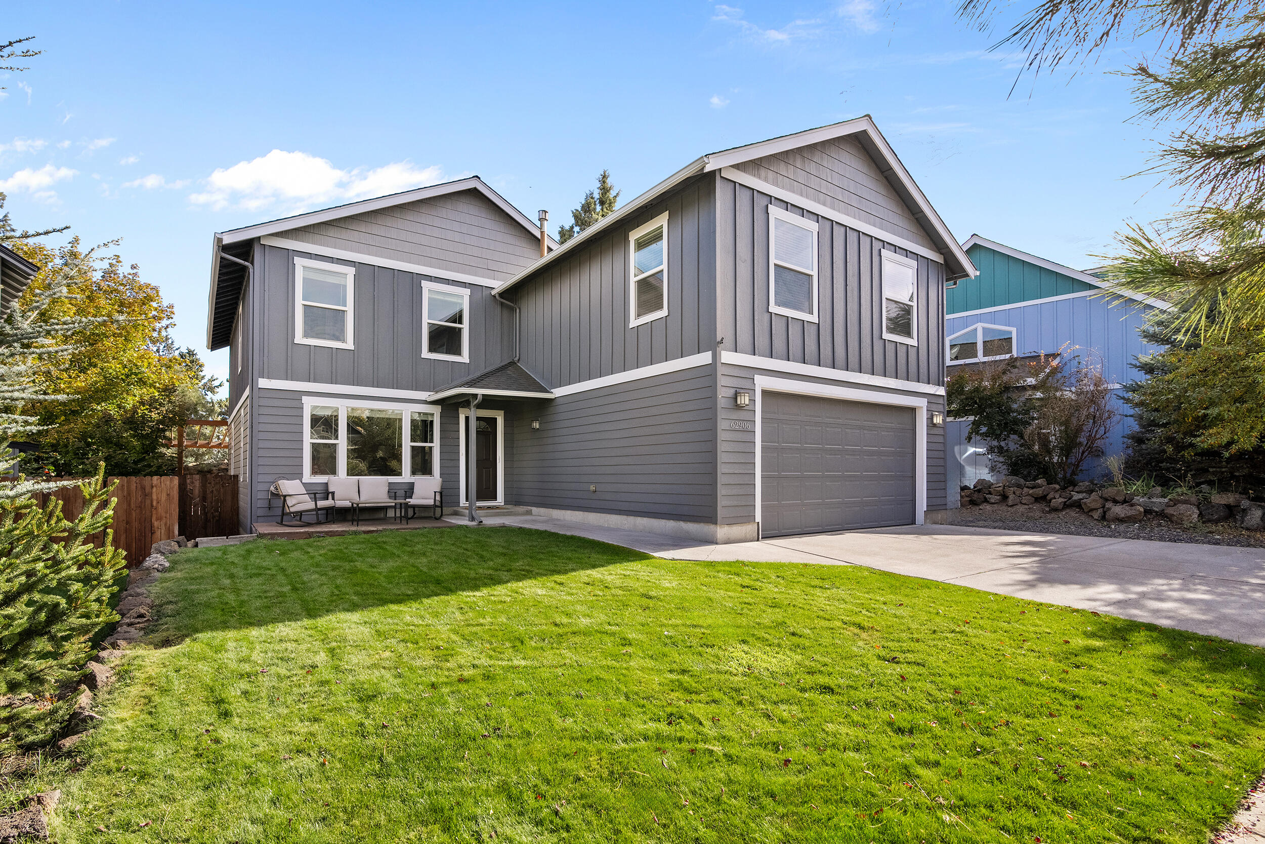 62906 Bilyeu Way Bend, OR 97701 - Photo 70 of 100 a front view of a house with a yard and garage