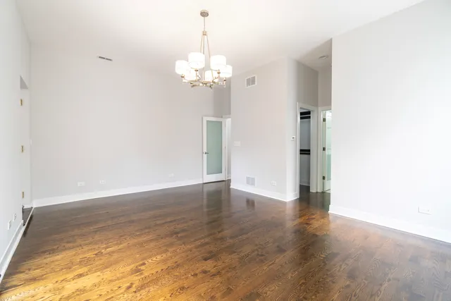 a view of a chandelier in an empty room