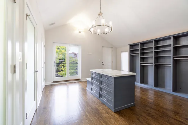 a room with cabinets and wooden floor