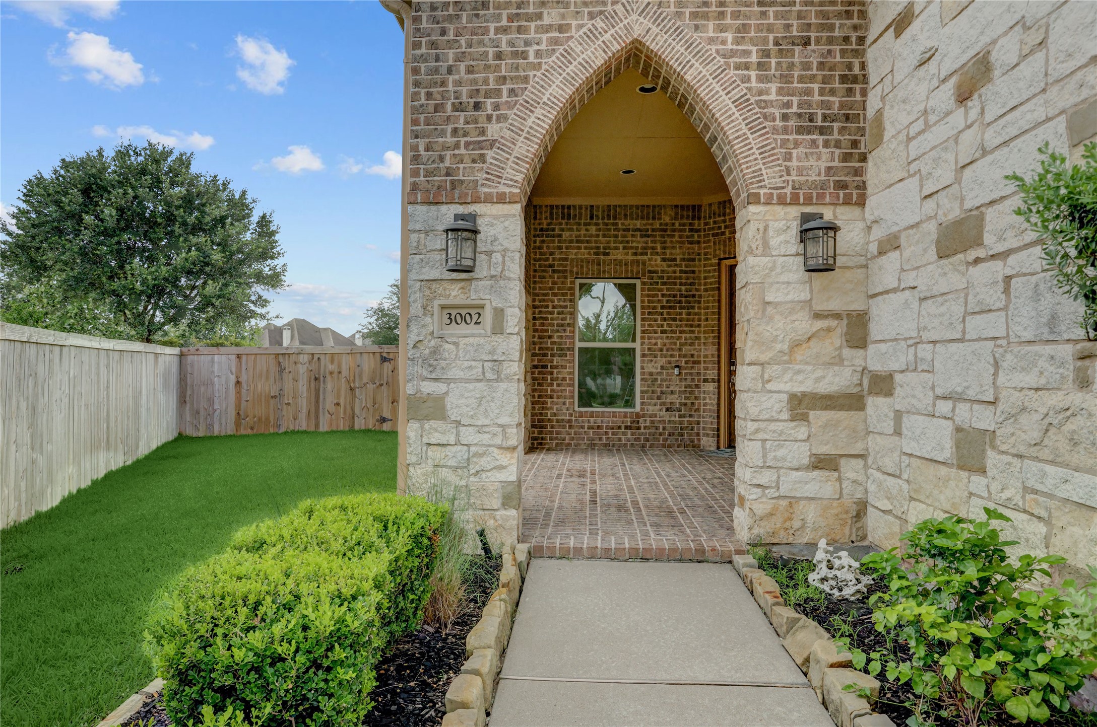 3002 Currant Drive Manvel, TX 77578 - Photo 3 of 43 a view of a brick house with a yard