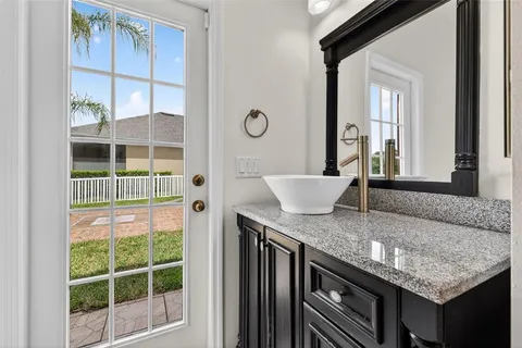 a kitchen with granite countertop a sink and a window