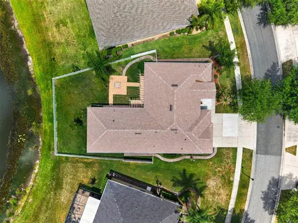 an aerial view of a house with a garden