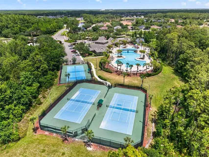 an aerial view of a house with yard swimming pool and outdoor seating