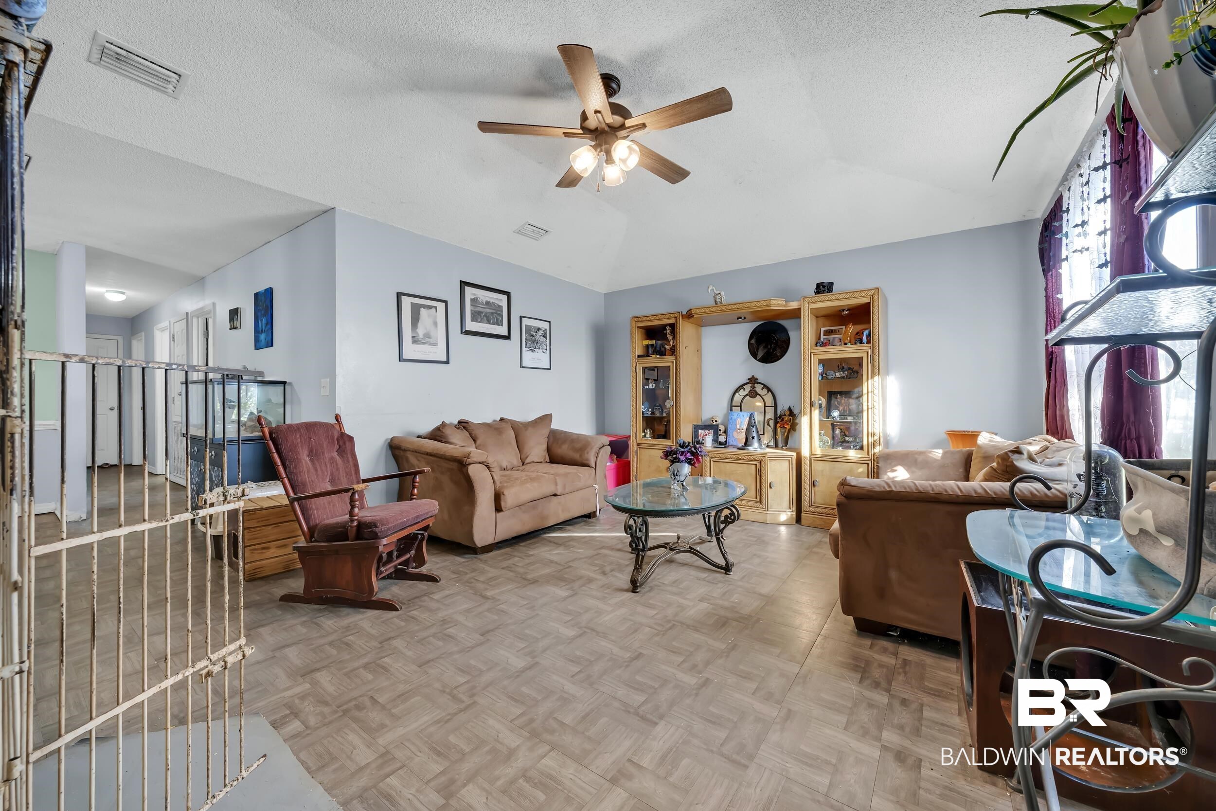 16603 Vanilla Drive Foley, AL 36535 - Photo 5 of 19 Living area with a textured ceiling, ceiling fan, and vaulted ceiling