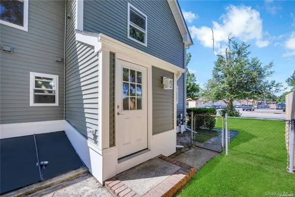 a view of a chair in backyard of the house