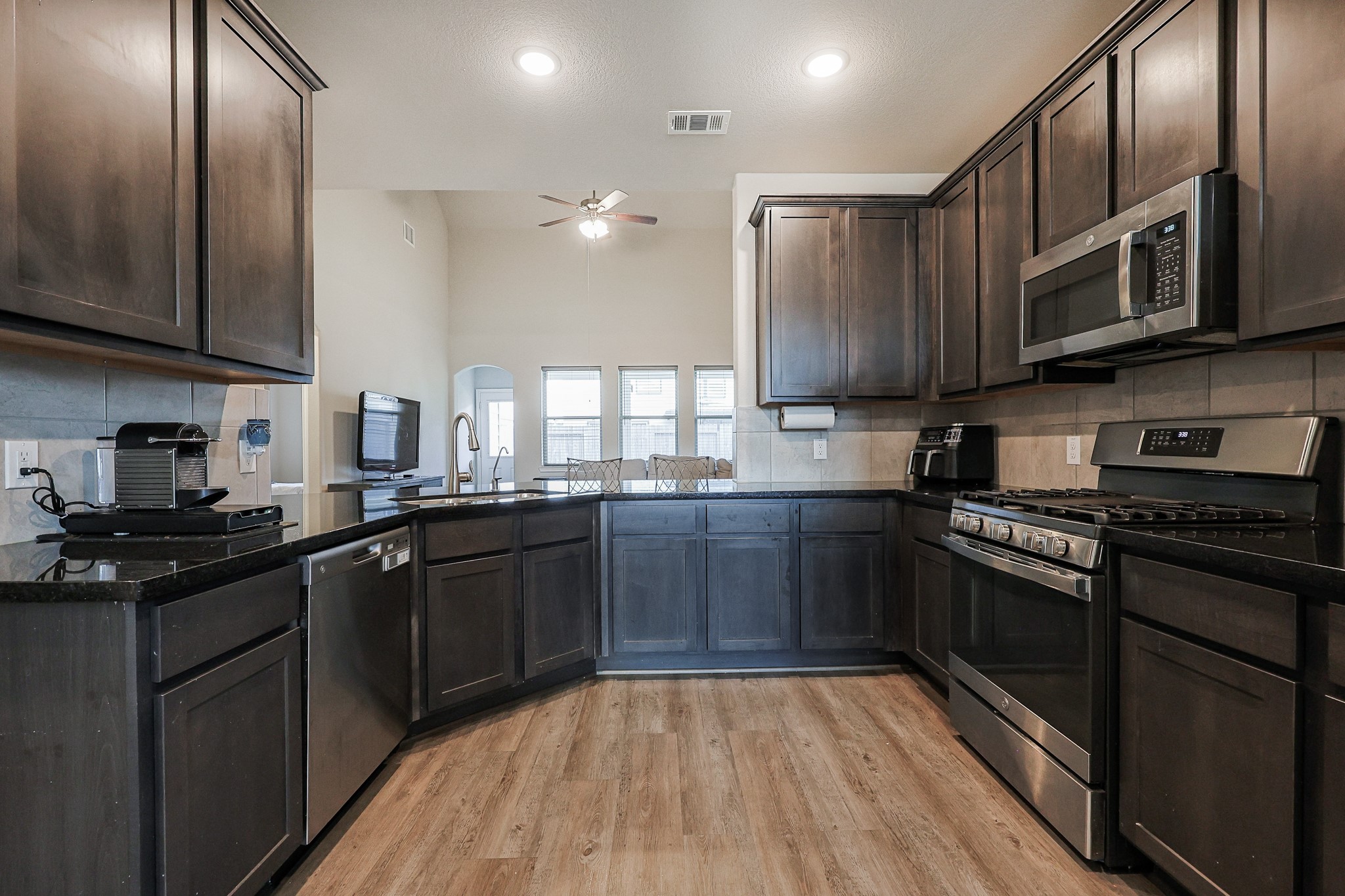 10423 Rochester Hls Lane Tomball, TX 77375 - Photo 12 of 36 An absolute dream for the home chef, this beautifully appointed kitchen combines contemporary style with an ultra-functional layout.